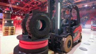 A female forklift truck driver concentrates hard as she tackles the course